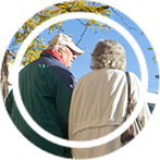 Circular photo of an elderly couple walking in winter